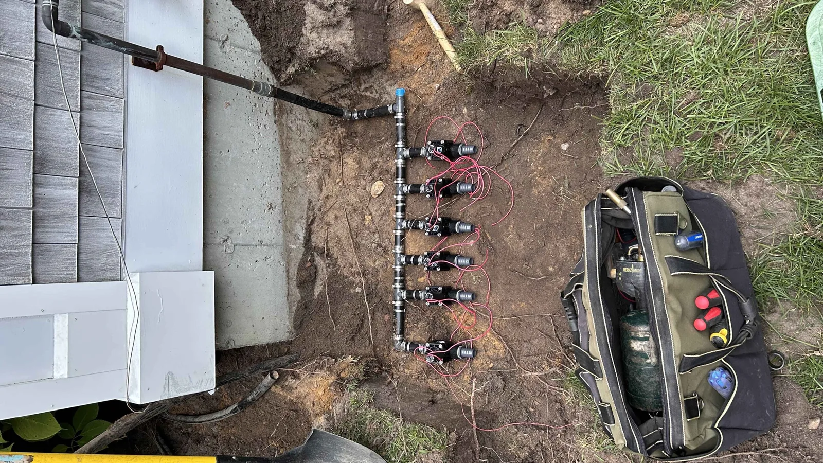 Irrigation system lines being installed across a Martha's Vineyard property